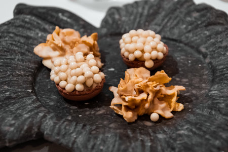Delicious dark and white chocolate bonbons as a dessert in a restaurant