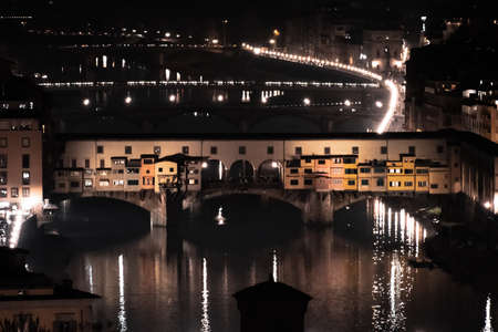Views of Ponte Vecchio lighten up in Florence at nightの写真素材