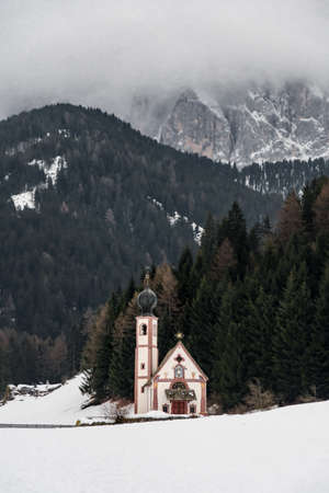 Little Saint John's church in Val di Funes, Dolomite during snowy winterの写真素材