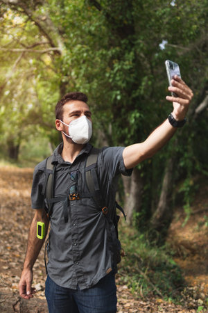 Boy making a selfie in the mountains. Hiking. Concept of health. Spainの写真素材