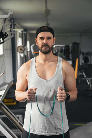 Man performing exercises with an elastic band.の写真素材