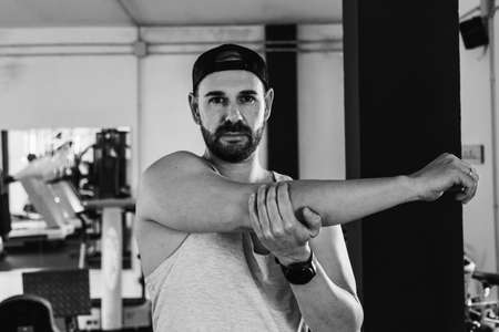 Man stretching in the gym. Health conceptの写真素材