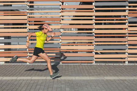 A Latina woman sprints in a raceの写真素材