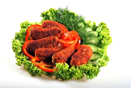 roasted cutlets with lettuce and tomatosの写真素材