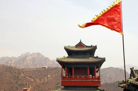 landscape with red flag and pagoda on Great Wall China のeditorial素材