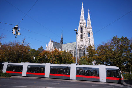 Gothic cathedral with a tram on the foreground(Vienna, Austria)