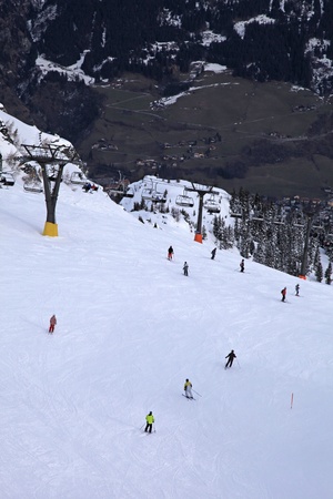 Ski slopes with lifts and skiers in Alps(Austria)の写真素材