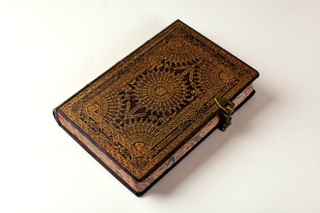 Old ornate notebook with leather stamped coverの写真素材