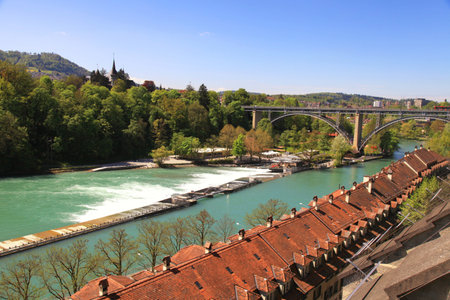 Cityscape of Bern  Switzerland  with arch bridge and old houses beside the Aare Riverの写真素材