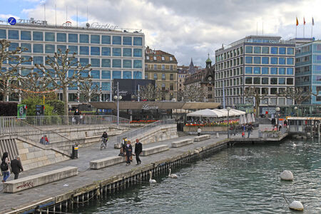 GENEVA, SWITZERLAND - MAY 10, 2013: Cityscape view with embankment on the banks along Lake Geneva, Geneva, Switzerland.のeditorial素材