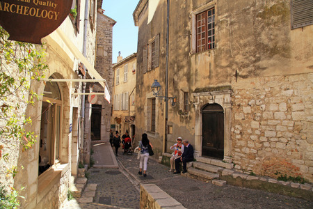SAINT-PAUL-DE-VENCE, FRANCE - MAY 12,2013: Tourists walk in the medieval town Saint-Paul-de-Vence, Provence, France. One of the oldest medieval towns on the French Riviera, it is well known for its modern and contemporary art museums and galleries のeditorial素材