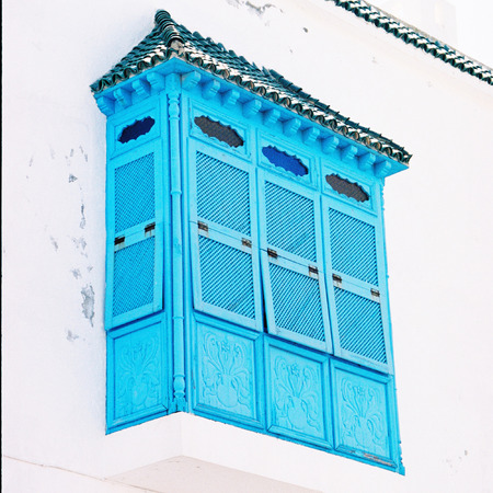 Old House with white wall and  blue balcony, Sidi Bou Said, Tunisiaの写真素材