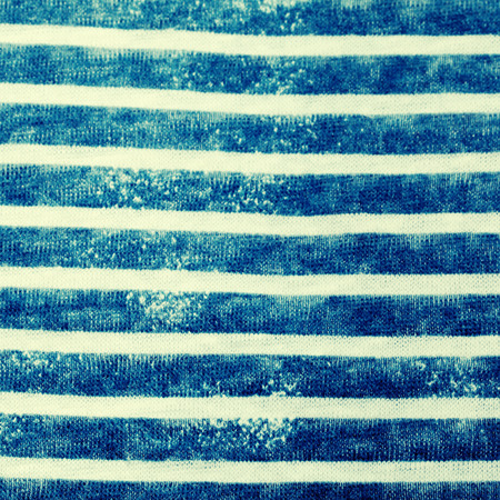 striped white and blue cotton fabric as a background textureの写真素材