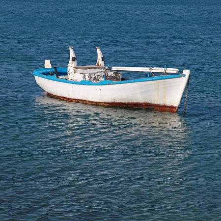 Blue and white old wood boat at a Mediterranean sea(Greece) Square image