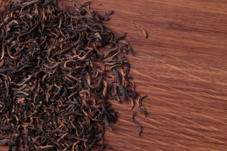 dried tea leaves on wooden background with copy spaceの写真素材