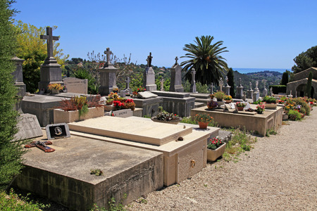 SAINT-PAUL-DE-VENCE, FRANCE - MAY 12, 2013: Tombstone with the cross and crucifix at the old cemetery in Saint Paul de Vence, Provence, France.のeditorial素材