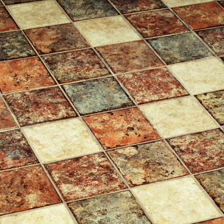 Vintage multicolor terracotta tile floor. Square toned imageの写真素材