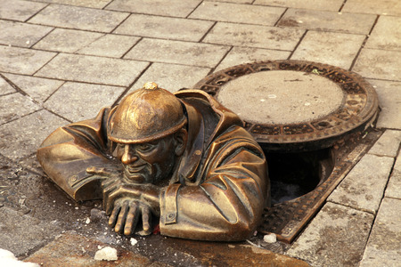 Bronze sculpture called  Cumil (The Watcher) or Man at work, Bratislava, Slovakiaのeditorial素材