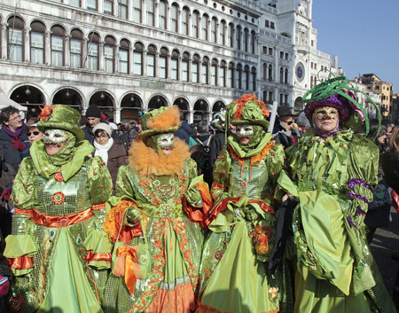 VENICE, ITALY - FEBRUARY 8, 2015: Unidentified masked persons in costume on San Marco Square during the Carnival in Venice, Italy.のeditorial素材