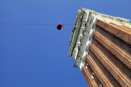 VENICE, ITALY - FEBRUARY 8, 2015: "Flight of the angel", a traditional annual event marking the famous Venetian carnival at St Mark's Square in Venice, Italy.のeditorial素材