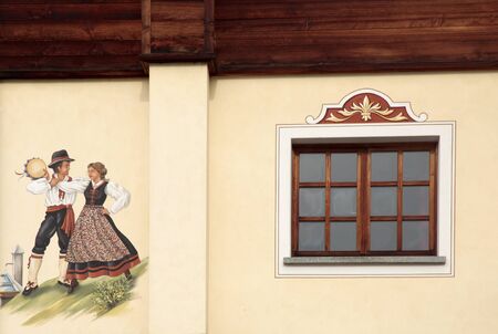 Detail of typical old alpine house with window and frescoのeditorial素材