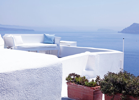 Beautiful relax sea view terrace with white sofa, Santorini island, Greeceの写真素材