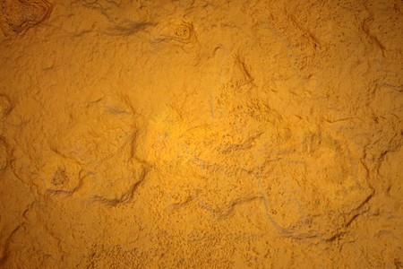 Terra yellow painting stone texture wallpaper design to backgroundの写真素材