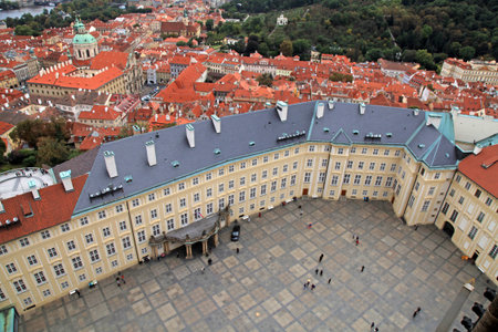 Over view of the main courtyard at the Prague Castle and red roofs from belltower of St. Vitus cathedralのeditorial素材