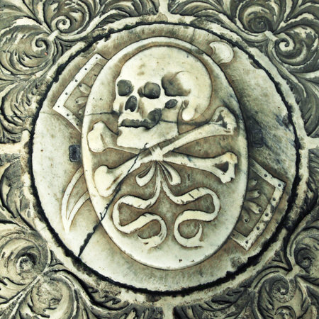 Skull on the medieval marble tomb in Monumental cemetery Camposanto, Pisa, Italy. square toned...