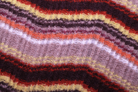 brown and orange knit woolen textured background striped zigzagの写真素材
