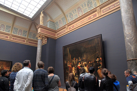 AMSTERDAM, THE NETHERLANDS - MAY 4, 2016: Visitors looking at the famous The Night Watch by Rembrandt at the Rijksmuseum in Amsterdam, Netherlands.のeditorial素材