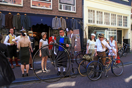 AMSTERDAM, NETHERLANDS - MAY 8, 2016: Unidentified people in vintage style clothes with their bicycles on Tweed Ride, Amsterdam, Netherlands. This event is dedicated to the style of old England.のeditorial素材