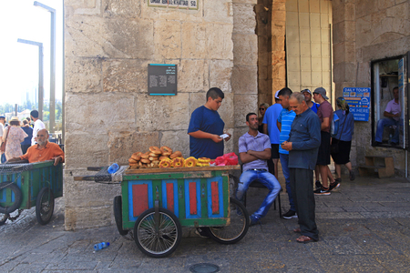 JERUSALEM, ISRAEL - AUGUST 23, 2016: Sellers of typical bagel bread with cart near Jaffa Gate in the Old City of Jerusalem, Israel.のeditorial素材