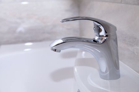 close up view of nice faucet in modern bathroom, selective focusの写真素材