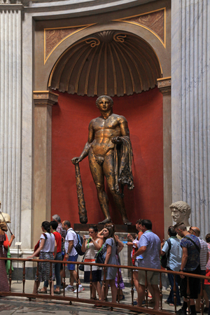 VATICAN, ROME, ITALY - JULY 15, 2017: Tourists and Hercules sculpture in Round Room of Pio-Clementino Museum in Vatican museums, Vatican city, Rome, Italyのeditorial素材
