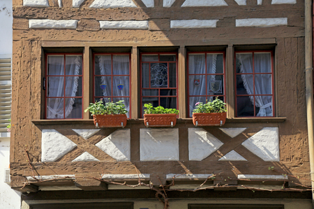 architectural detail of traditional half-timbered window balcony at old medieval town, Switzerland.の写真素材