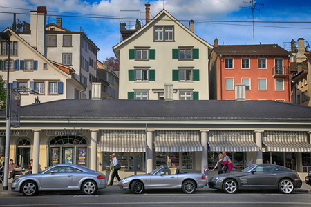 ZURICH, SWITZERLAND - MAY 5, 2013: Cityscape with buildings, people and expensive luxury cars on the street in Zurich, Switzerland. のeditorial素材