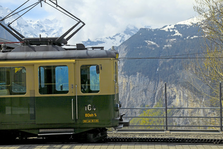 JUNGFRAU, SWITZERLAND - MAY 07, 2013: Railway station with swiss train and mountains in Jungfrau, Switzerland. Train starts from Kleine Scheidegg and takes you directly to the Jungfraujoch-Top of Europe.のeditorial素材