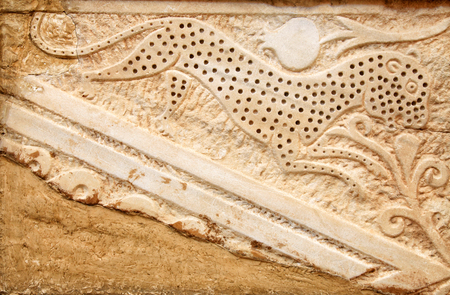 The close up of stone bas-relief sculpture detail on the ancient wall, Cyprusの写真素材