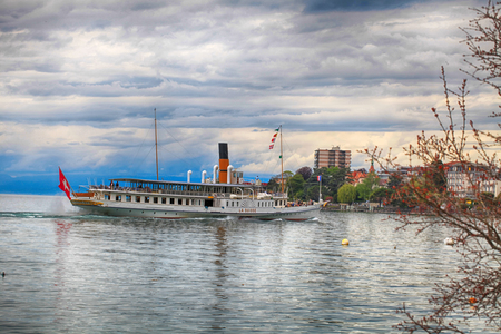 MONTREUX, SWITZERLAND - MAY 09, 2013: Cruise boat La Suisse on Lake Geneva (Lac Leman) in Montreux, Switzerland. Paddle steamer La Suisse built in 1910.のeditorial素材