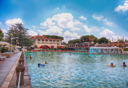 VITERBO, ITALY - JULY 24 2016: People relax in natural hot pool of Terme dei Papi (meaning Spa of the Popes), Viterbo, Italy. The thermal waters of Terme dei Papi have been synonymous with health and well-being since ancient times.のeditorial素材