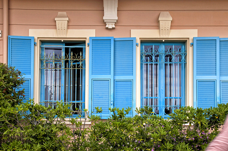 Vintage windows with blue shutters in old house, Provence, Franceのeditorial素材