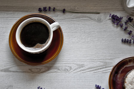 Morning moments of relaxation and relaxation with fresh coffee and dessert on a wooden background
