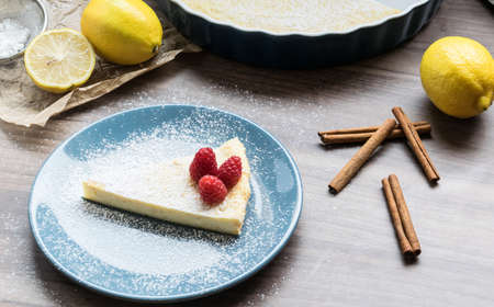 Homemade cheesecake with raspberries and lemon. Delicate dessert for coffeeの写真素材