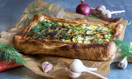 Great homemade baked zucchini cake with dill and sour creamの写真素材