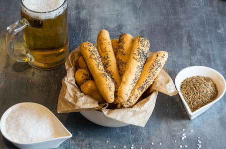 Homemade salty pastry with salt and poppy seeds. Excellent as a complement to beerの写真素材