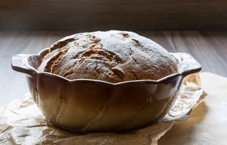 Excellent crunchy homemade bread baked in a baking dishの写真素材