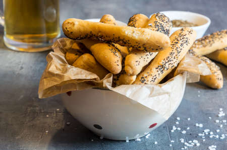 Home made salty pastry with salt and poppy seeds. Excellent as a complement to beerの写真素材