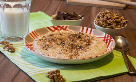 Delicious oatmeal with chocolate and walnuts. Excellent breakfastの写真素材