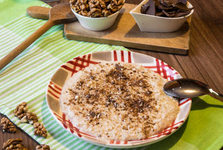 Delicious oatmeal with chocolate and walnuts. Excellent breakfastの写真素材